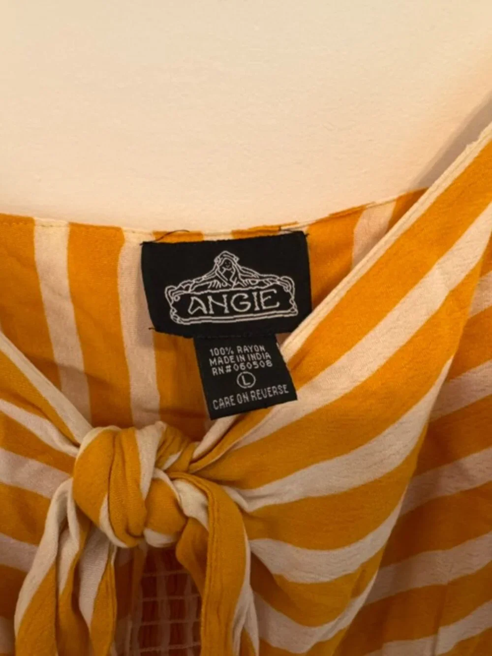 Yellow and white stripped dress with buttons and twist front
